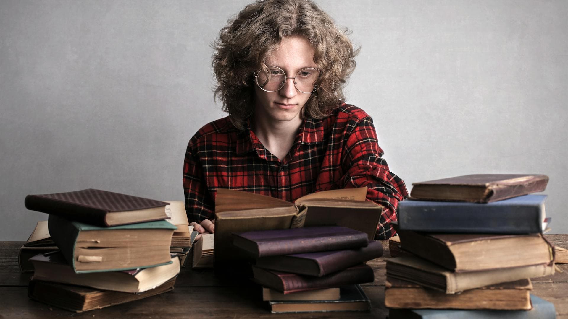 Secondary student studying with textbooks — Australian curriculum-based tutoring